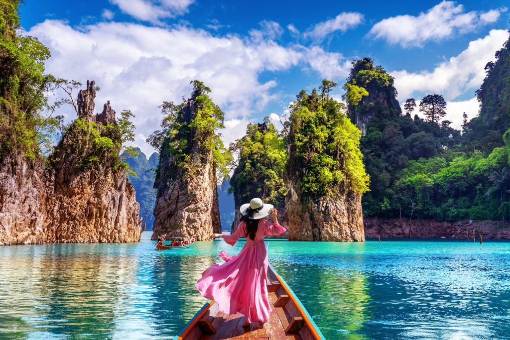 beautiful girl standing boat looking mountains ratchaprapha dam khao sok national park surat thani province thailand
